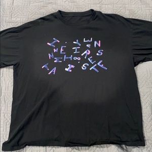 Black short sleeved shirt with scattered letters